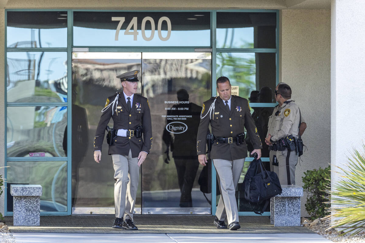 Officers leave a public viewing for Metro Det. Justin Terry at Palm Cheyenne Mortuary who died ...