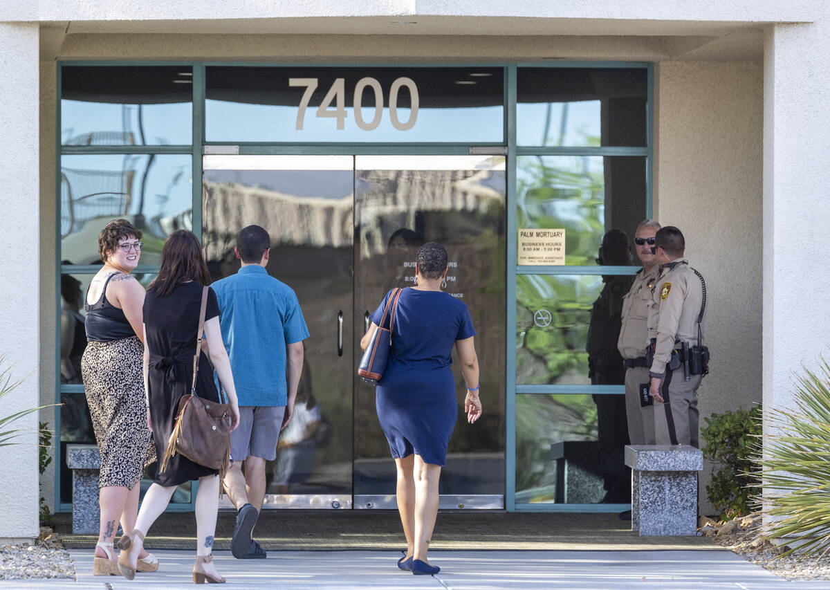 People arrive for a public viewing for Metro Det. Justin Terry at Palm Cheyenne Mortuary who di ...