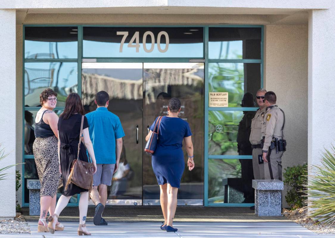 People arrive for a public viewing for Metro Det. Justin Terry at Palm Cheyenne Mortuary who di ...