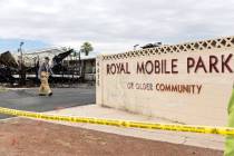 Clark County Fire Department and Las Vegas Fire and Rescue investigate the scene of a fire wher ...