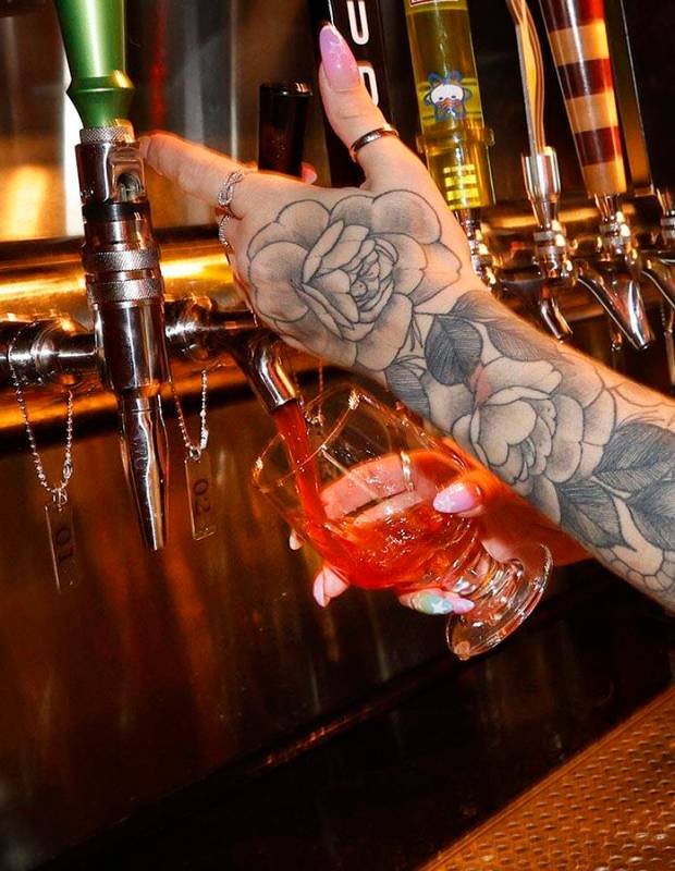 Devin Costentine, Atomic Liquors lead bartender pours Joseph James Suave Felon #003 into a glas ...
