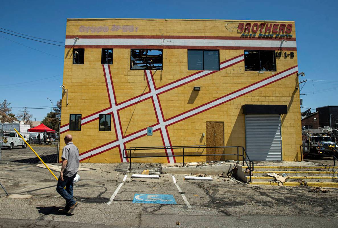 A damaged Brothers Auto Body Parts building is seen in the area where a fire damaged or destroy ...