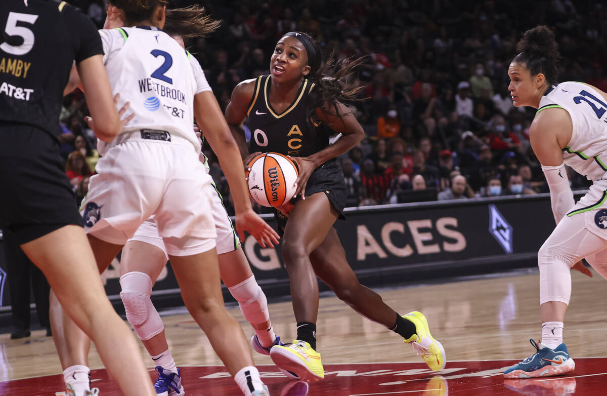 Las Vegas Aces guard Jackie Young (0) drives to the basket against the Minnesota Lynx during th ...