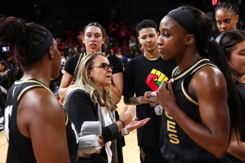 Las Vegas Aces head coach Becky Hammon talks with her players after they defeated the Minnesota ...