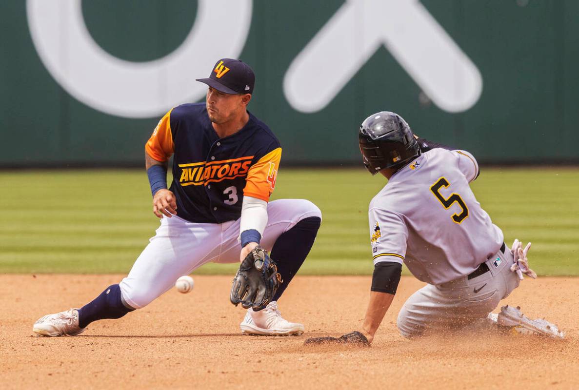 Aviators second baseman Christian Lopes (3) tries to field a low throw as Salt Lake Bees Kean W ...
