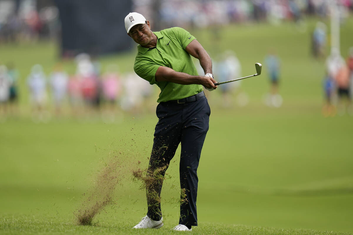 Tiger Woods hits from the rough on the second hole during the second round of the PGA Champions ...