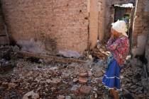 Hanna Sylivon, 76, stands inside her house destroyed by attacks in Chernihiv, Ukraine, Sunday, ...