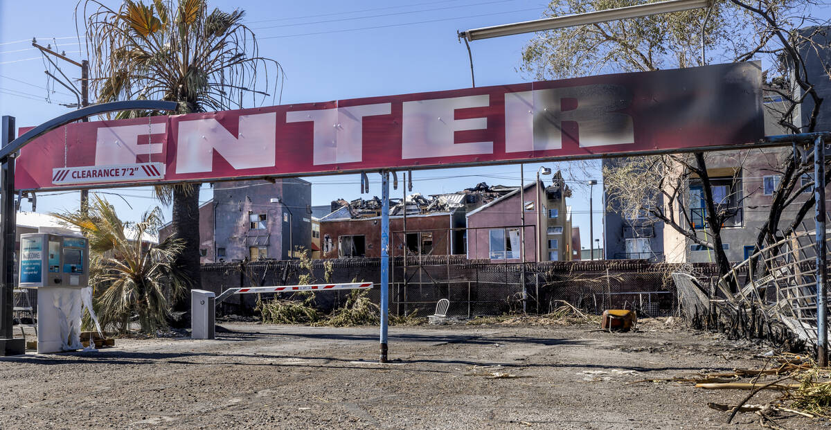 A sign was scorched but the Charleston West Car Wash property undamaged by fire nearby within t ...