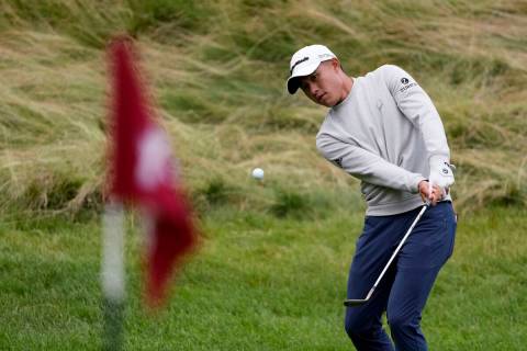 Collin Morikawa hits on the 10th hole during the third round of the U.S. Open golf tournament a ...