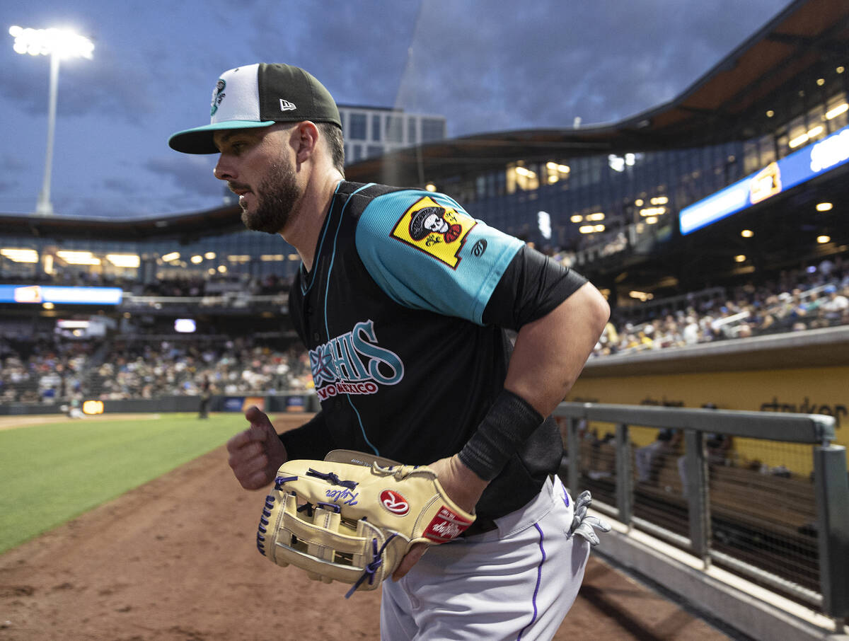 Colorado Rockies third baseman Kris Bryant takes the field during a rehab assignment with the A ...