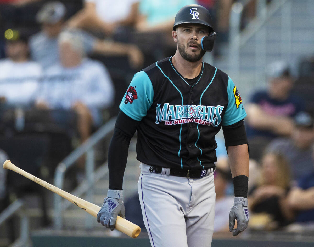 Colorado Rockies third baseman Kris Bryant walks back to the bench during a rehab assignment wi ...