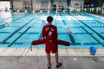 Aiden Ruggiutz, 18, a lifeguard, keeps an eye on swimmers at Pavilion Center Pool on Friday, Ju ...