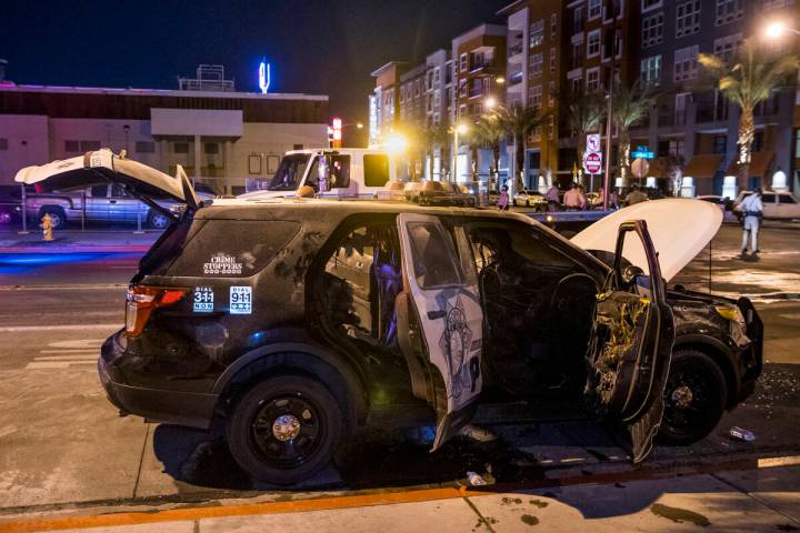 A Las Vegas police vehicle was set on fire around midnight on May 30, 2020, on Carson Avenue at ...