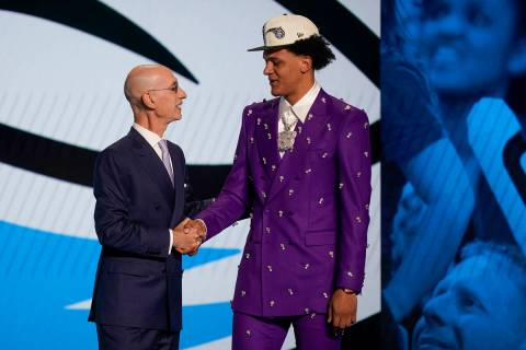 Paolo Banchero, right, is congratulated by NBA Commissioner Adam Silver after being selected as ...
