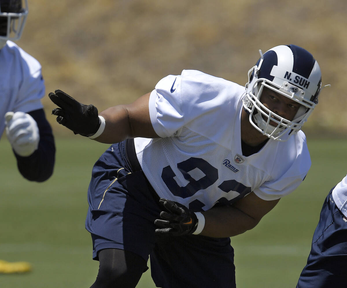 Los Angeles Rams defensive tackle Ndamukong Suh runs a play during practice at the NFL football ...