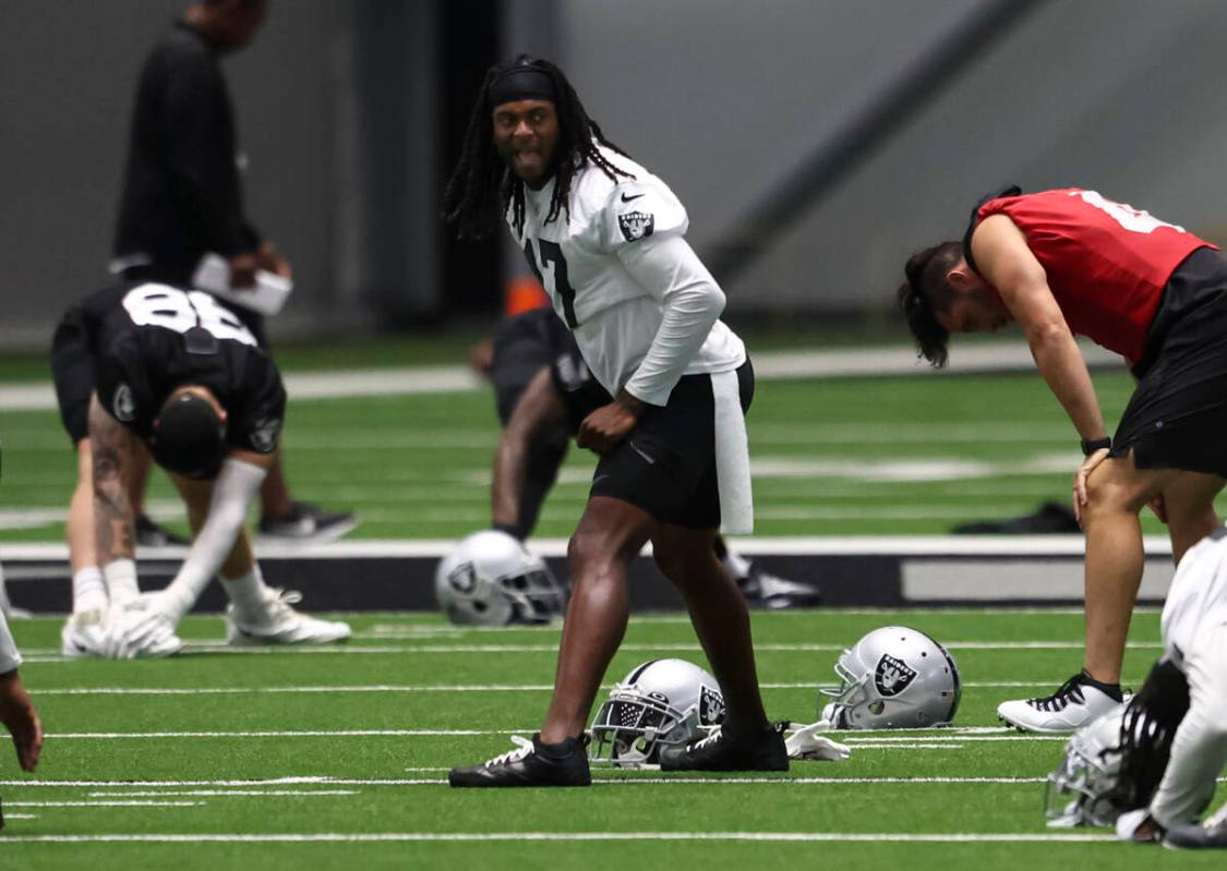 Raiders wide receiver Davante Adams stretches during minicamp training at Raiders Headquarters ...
