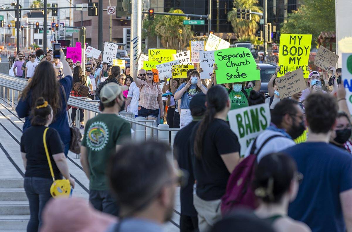 Protesters march up Las Vegas Boulevard in response to Roe v. Wade being overturned today near ...