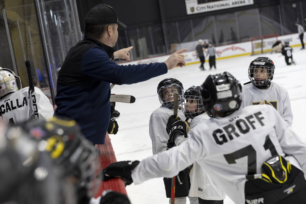 The Mavericks are coached in a timeout during a 10U Jr. Golden Knights Hockey League game again ...