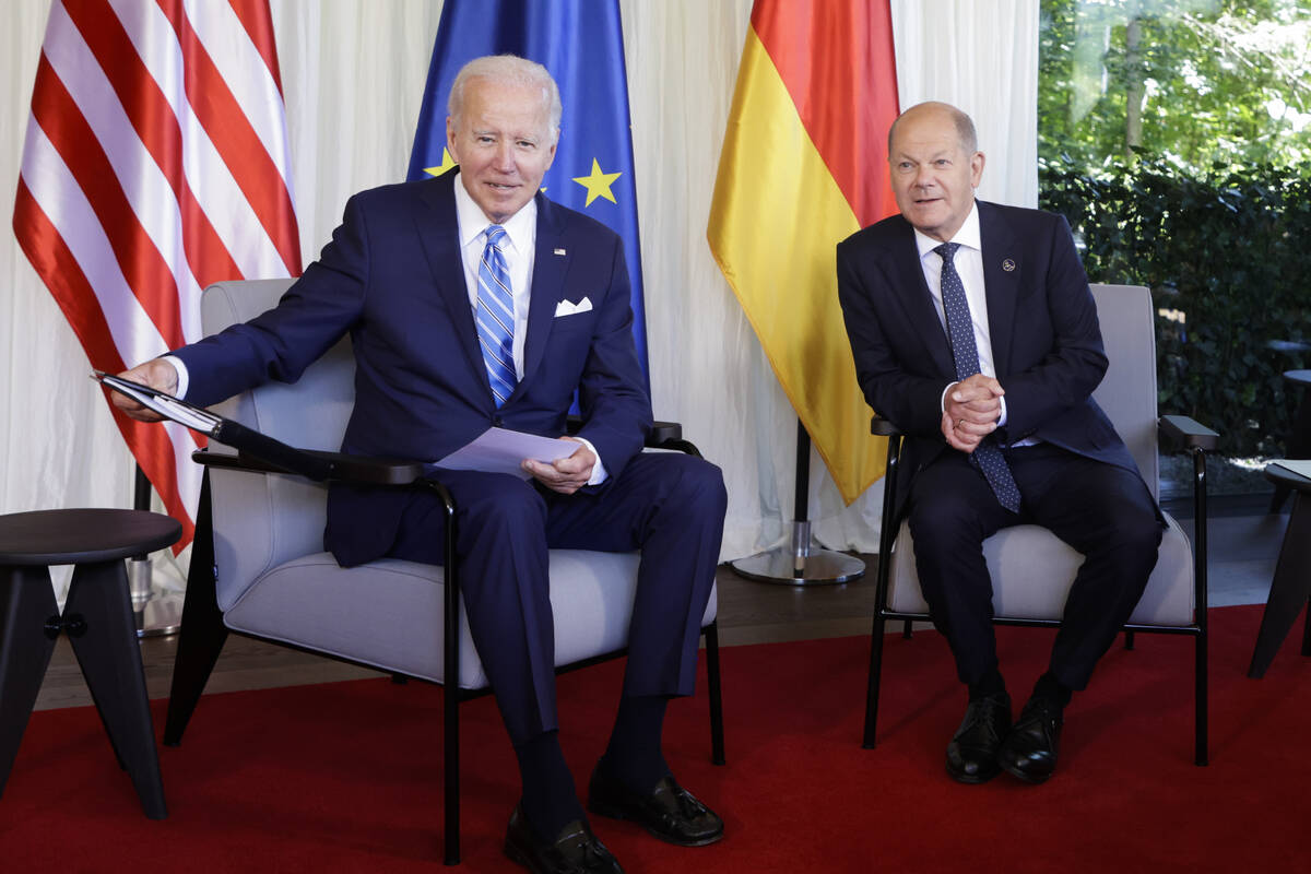 German Chancellor Olaf Scholz, right, welcomes US President Joe Biden, left, for a bilateral me ...