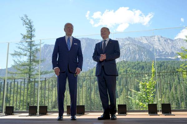 German Chancellor Olaf Scholz, right, welcomes US President Joe Biden, left, for a bilateral me ...