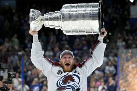 Colorado Avalanche left wing Gabriel Landeskog lifts the Stanley Cup after the team defeated th ...