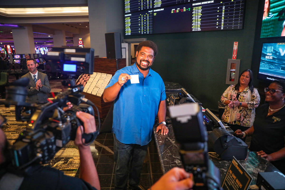 Football Hall of Famer Jonathan Ogden places the first bet at the newly renovated sportsbook at ...