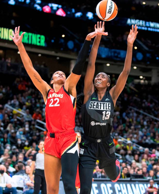 Seattle Storm's Ezi Macbegor, right, has her shot blocked by Las Vegas Aces' A'ja Wilson during ...
