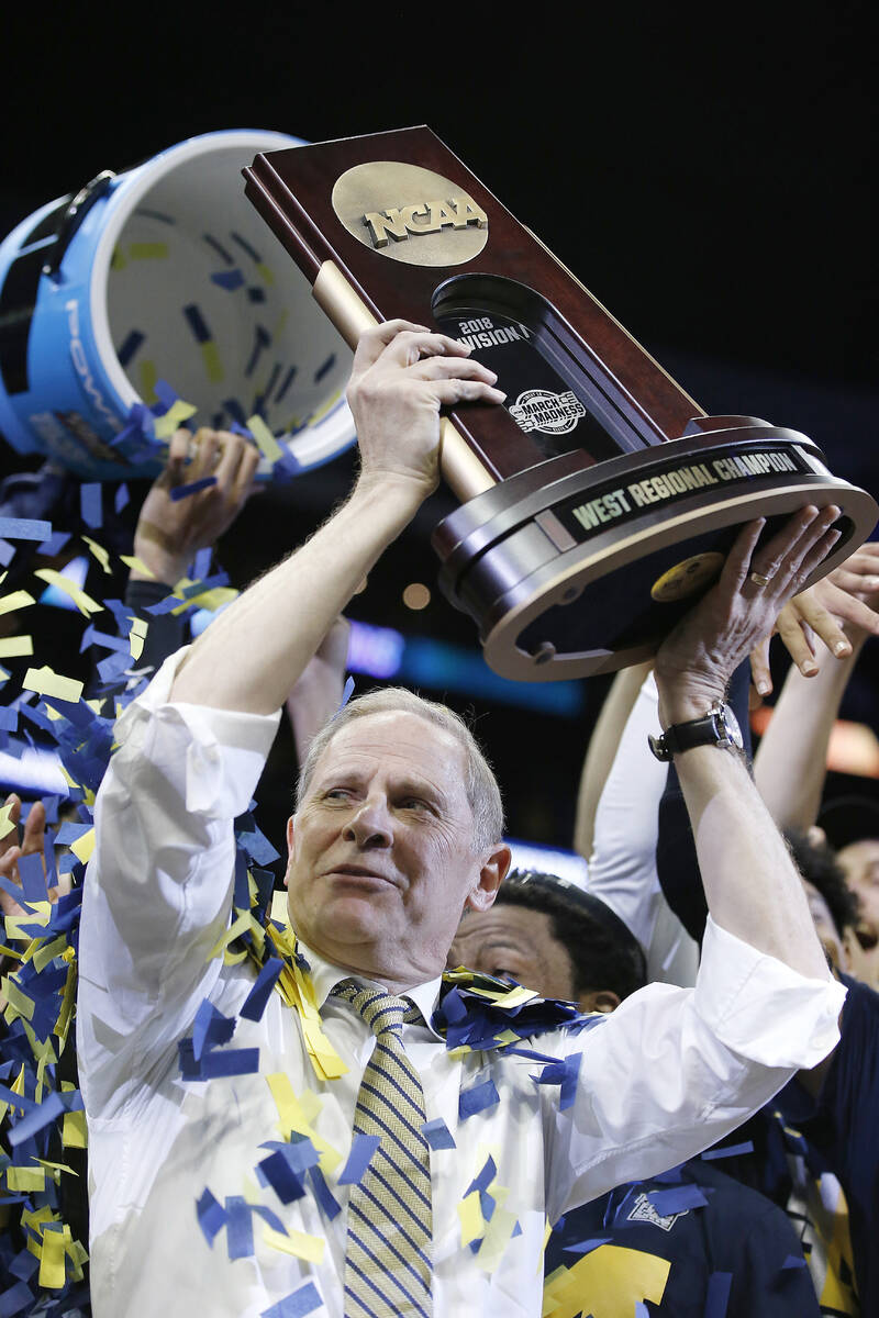 Michigan head coach John Beilein celebrates after beating Florida State in an NCAA college bask ...