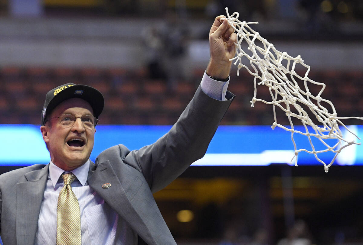 Oklahoma head coach Lon Kruger cuts down the net after their win against Oregon during an NCAA ...