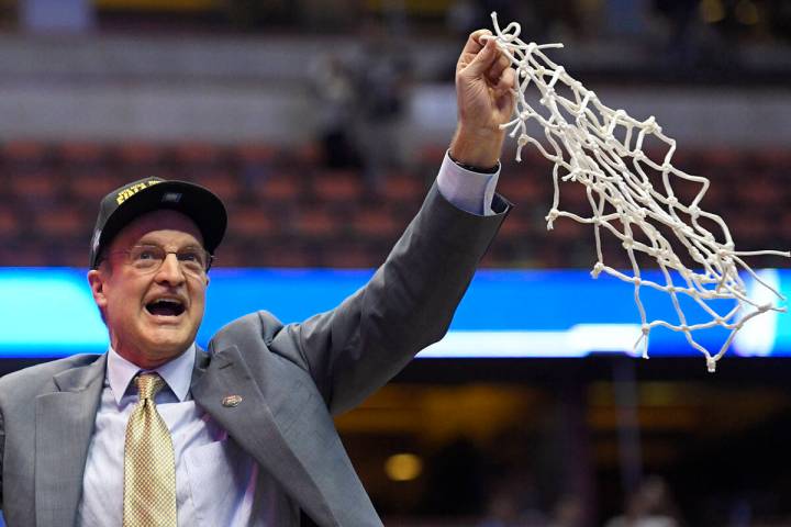 Oklahoma head coach Lon Kruger cuts down the net after their win against Oregon during an NCAA ...