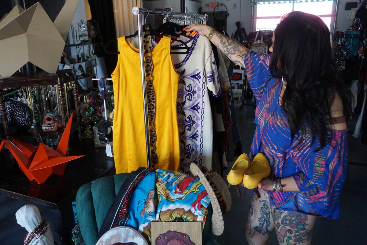Ruby Romero shows some of the vintage items that she carries in Sin Amor Studio, in the Arts Di ...