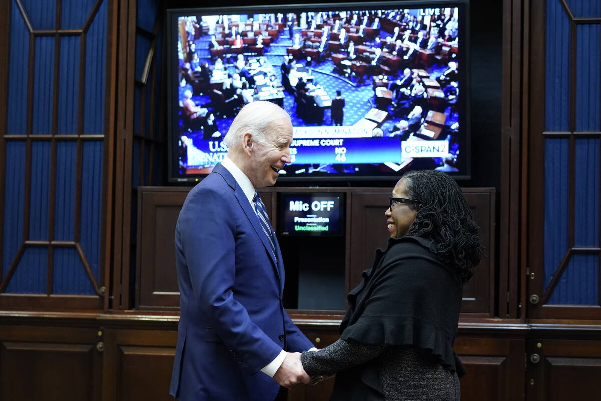 FILE - President Joe Biden talks with Supreme Court nominee Judge Ketanji Brown Jackson as they ...