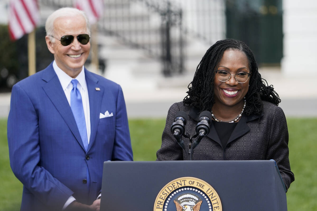 FILE - President Joe Biden listens as Judge Ketanji Brown Jackson speaks during an event on the ...