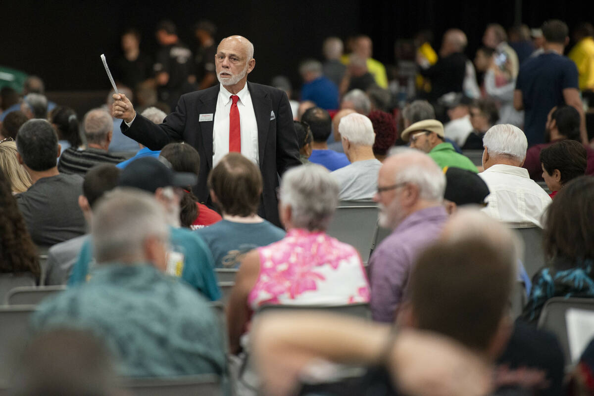 Auction worker Steve Zindars scans the crowd for bids during the opening day of the Barrett-Jac ...