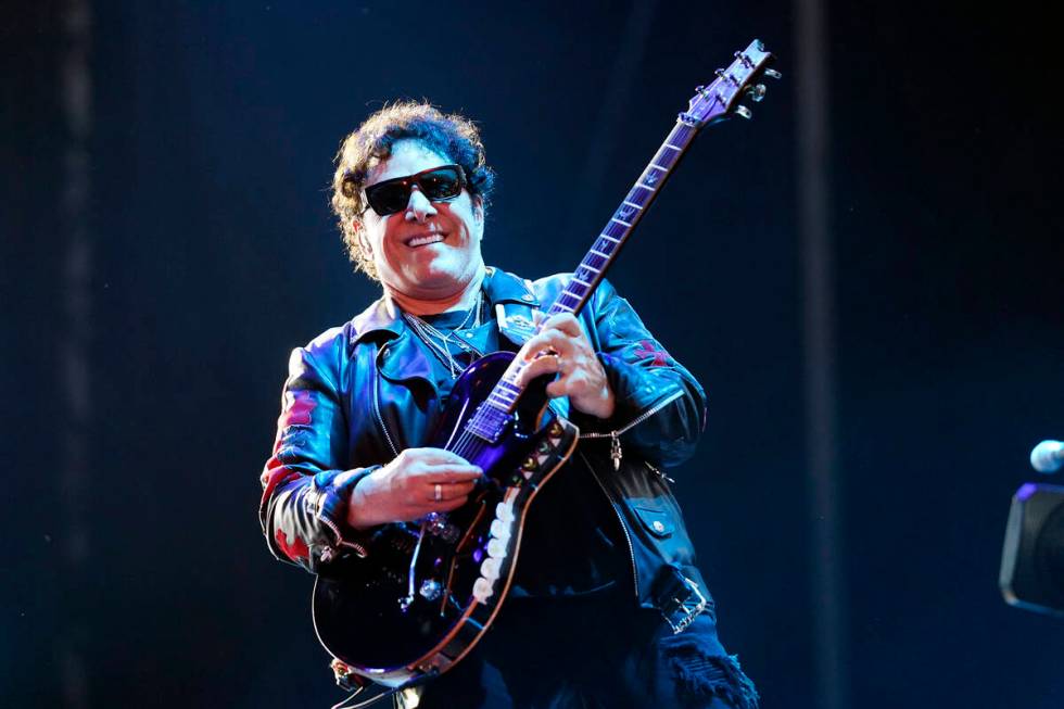 Neal Schon of the band Journey performs on day three of the Lollapalooza music festival on Satu ...
