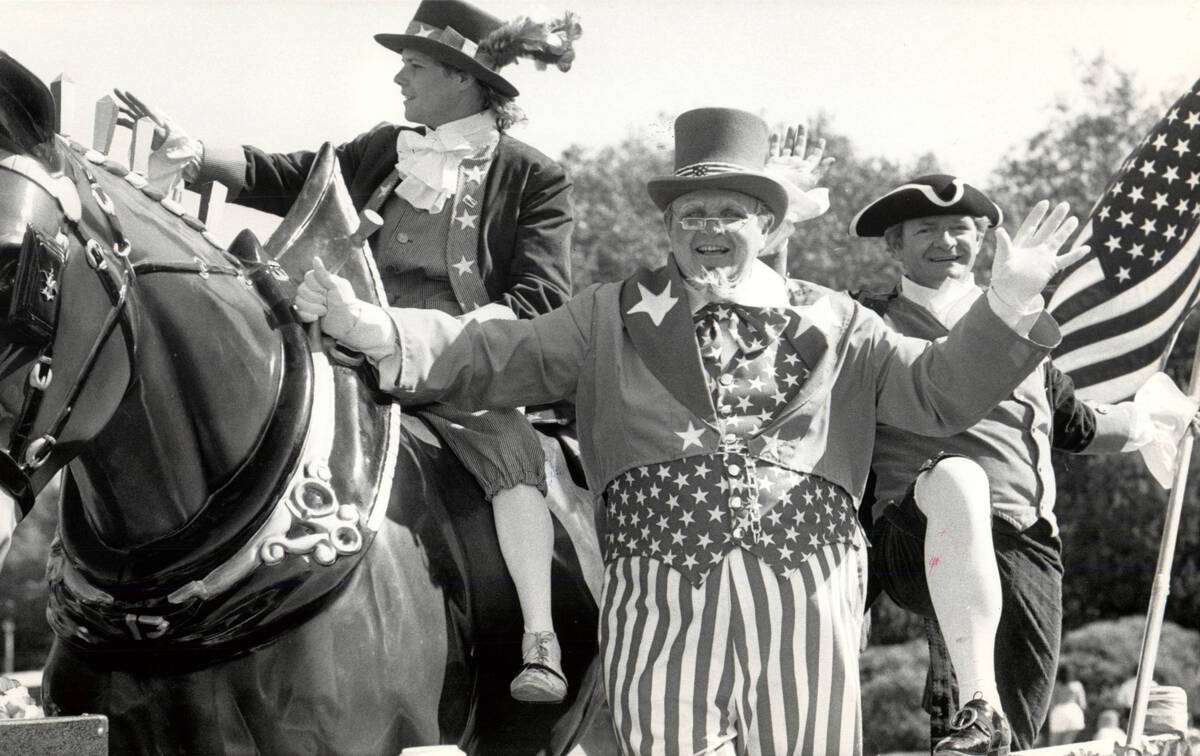 This July 4, 1986, file photo shows men dressed in patriotic garb for Fourth of July parade. (W ...