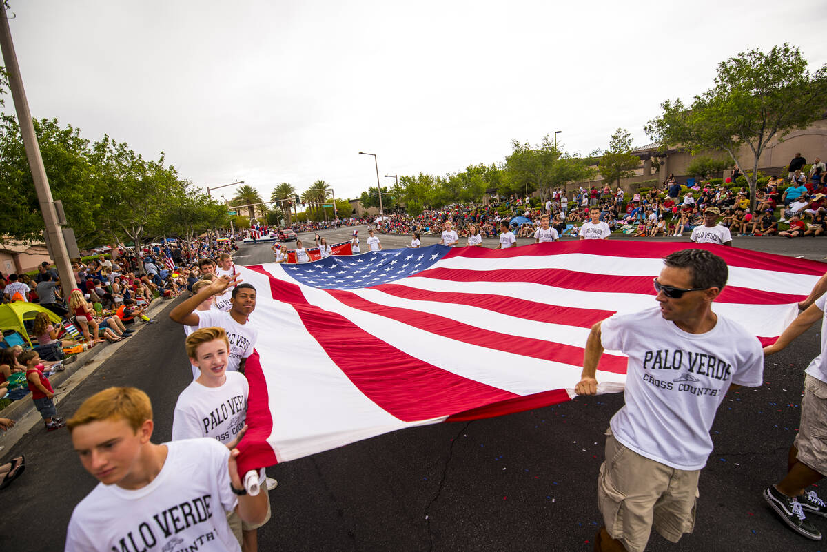 In this July 4, 2015, file photo, a giant American flag is carried during the 21st Annual Summe ...