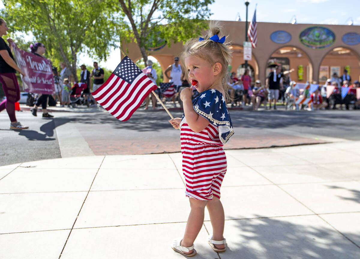 In this July 3, 2021, file photo, Olivia Ruecking enjoys a treat as the parade passes down Neva ...