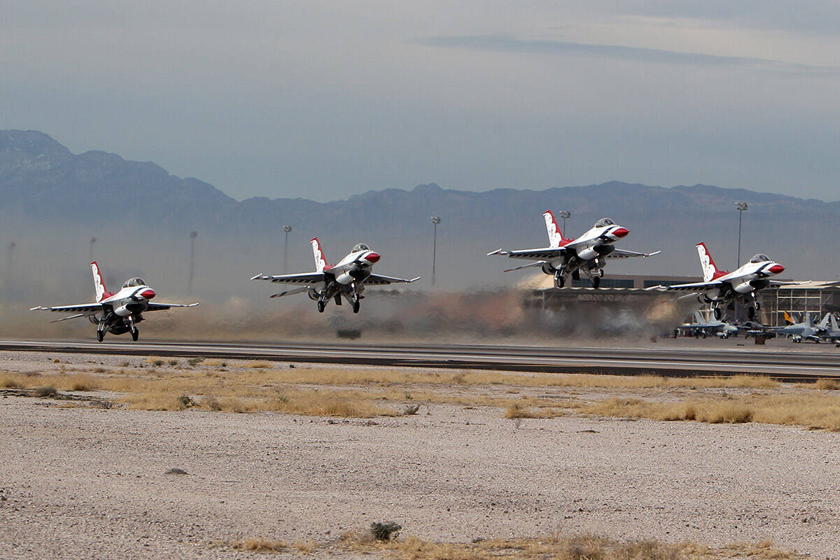 Four members of the U. S. Air Force Thunderbirds take off in unison during Red Flag media day a ...