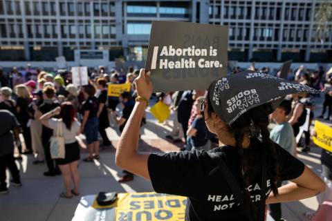 Iliana Diaz, education program manager at Planned Parenthood of the Rocky Mountains, protests d ...