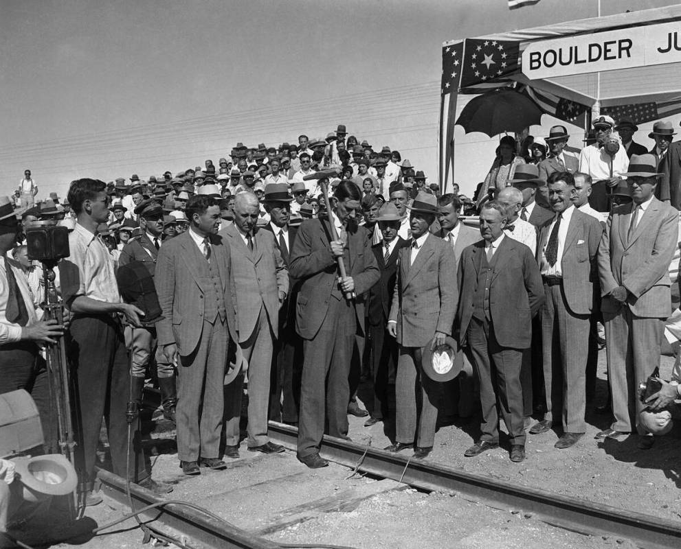 Secretary Ray Lyman Wilbur drives the last spike into the railroad leading from Las Vegas, Neva ...