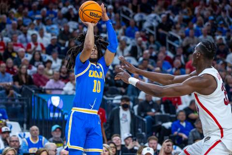 UCLA Bruins guard Tyger Campbell (10) elevates for a three-point basket over Arizona Wildcats c ...