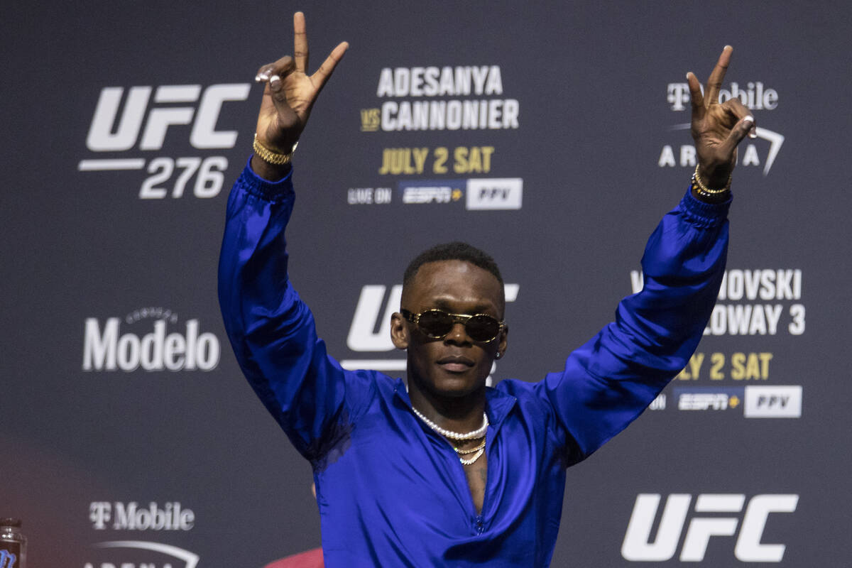 Israel Adesanya participates during an UFC 276 press conference at T-Mobile Arena in Las Vegas, ...