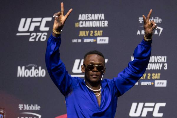 Israel Adesanya participates during an UFC 276 press conference at T-Mobile Arena in Las Vegas, ...