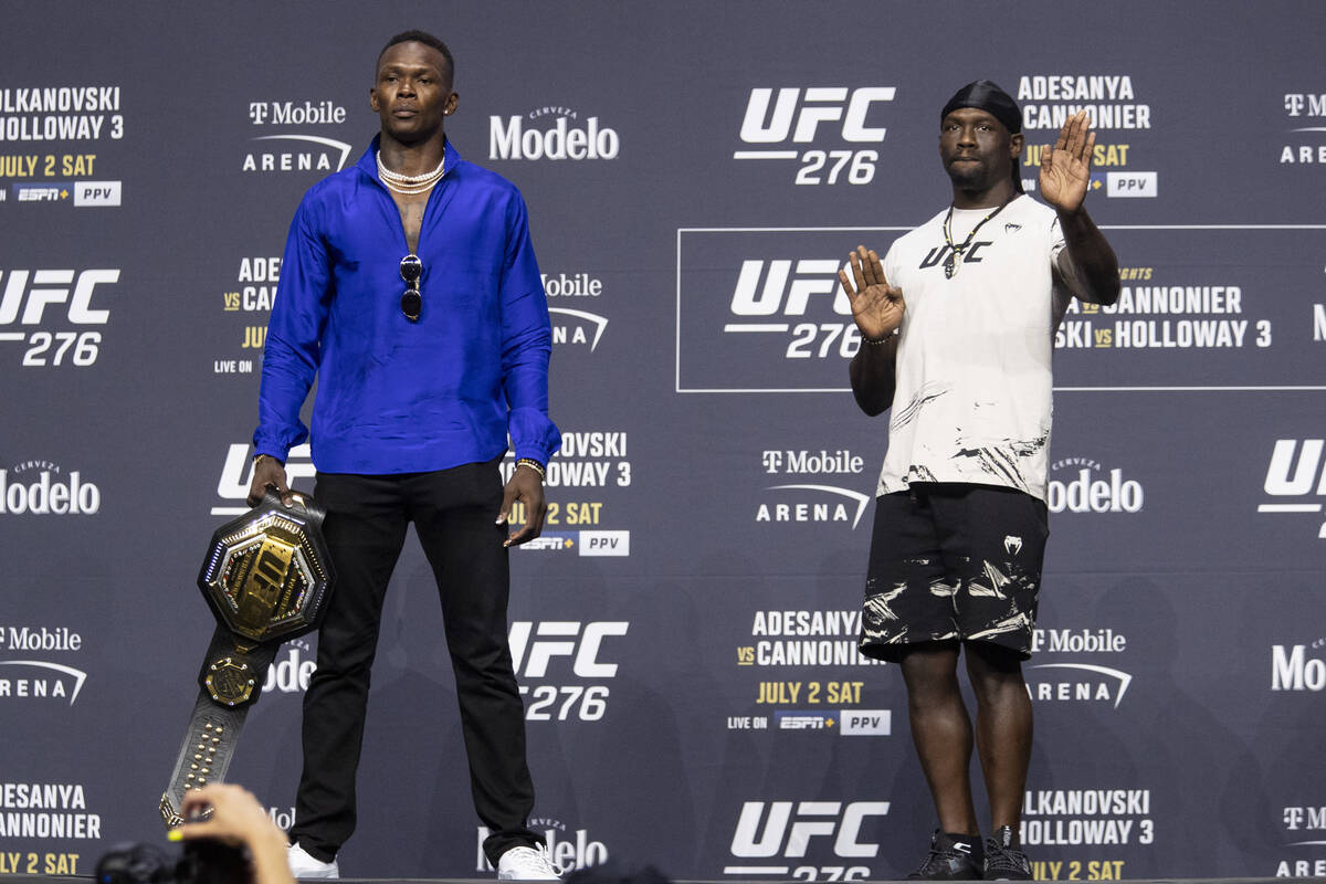 Israel Adesanya, left, and Jared Cannonier, pose during an UFC 276 press conference at T-Mobile ...