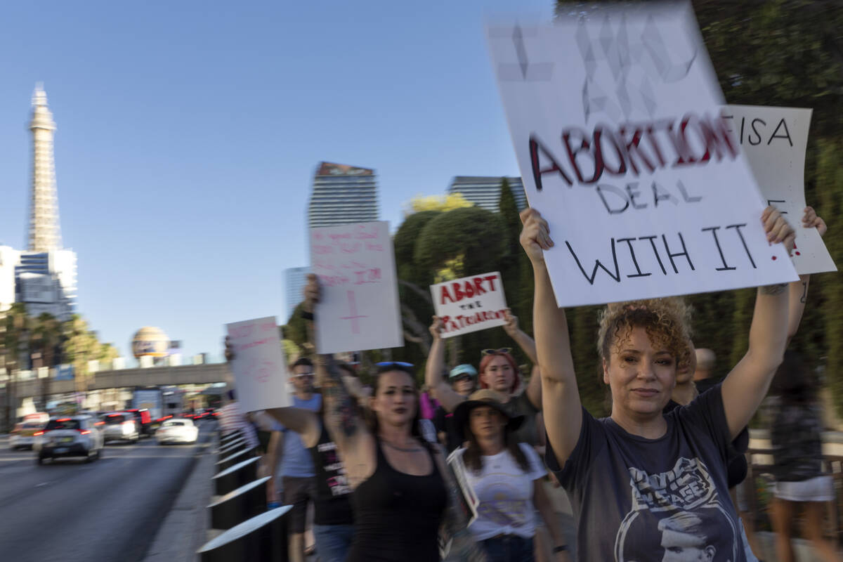 A rally for women’s rights makes way down Las Vegas Boulevard, Friday, July 1, 2022, on ...