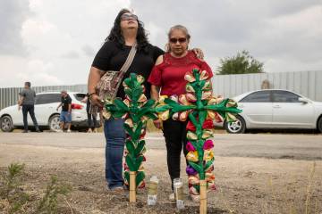 Debra Ponce, left, and Angelita Olvera pray near the scene, Tuesday, June 28, 2022, in San Anto ...