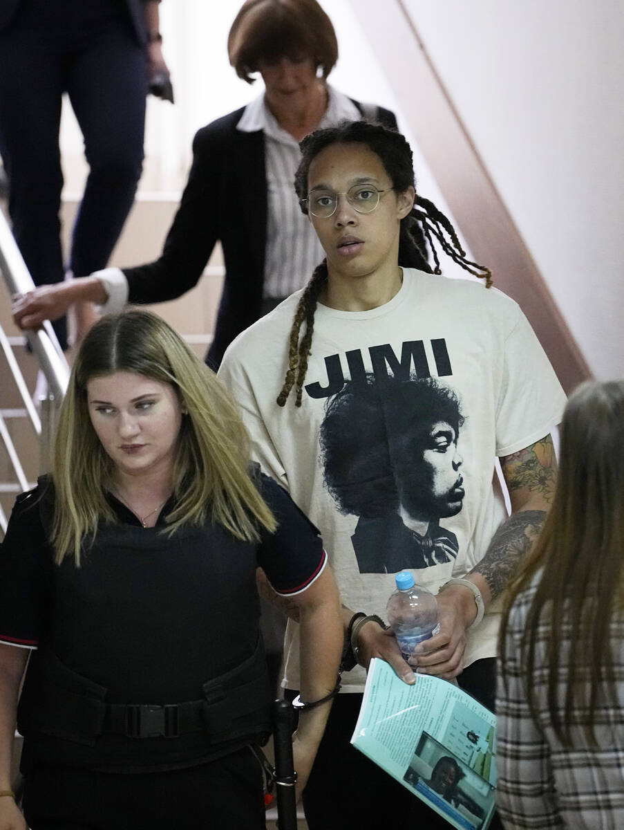 WNBA star and two-time Olympic gold medalist Brittney Griner is escorted to a courtroom for a h ...