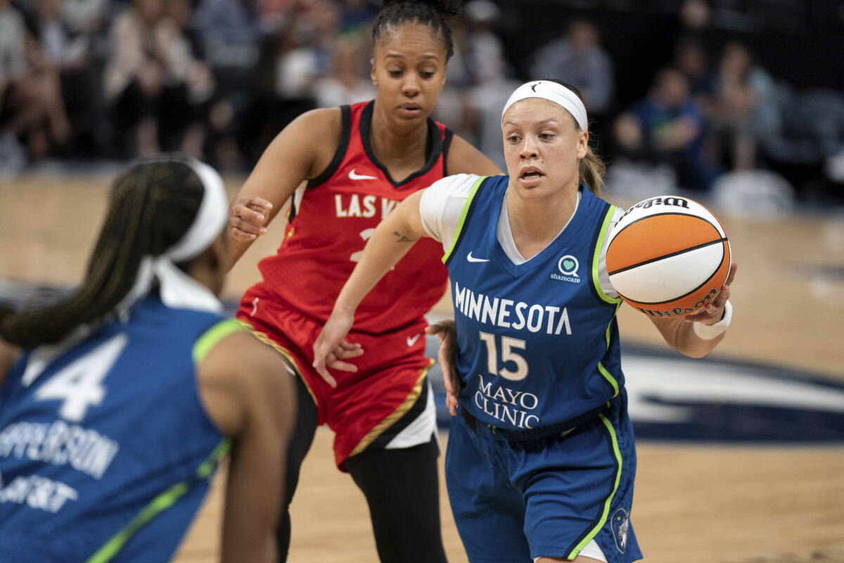 Minnesota Lynx guard Rachel Banham (15) drives against the Las Vegas Aces during a WNBA basketb ...