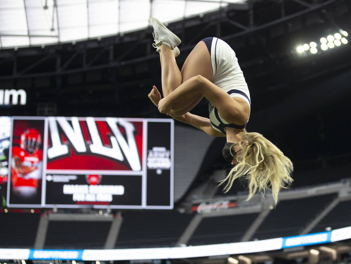The Utah State cheerleaders perform in the first half during an NCAA college football game agai ...